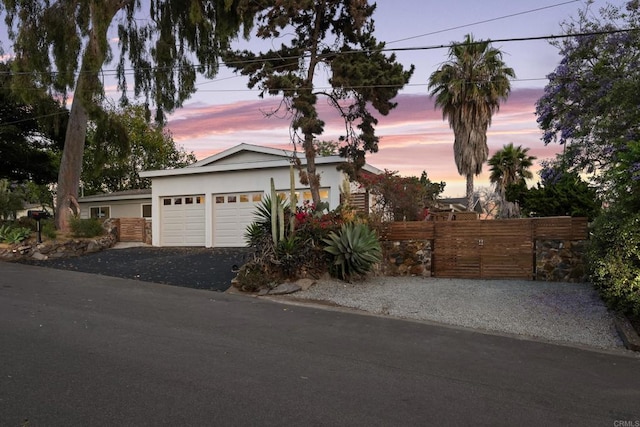 835 Cathy Ln, Cardiff By The Sea, CA 92007 - ranch-style house featuring an attached garage, asphalt driveway, and stucco siding