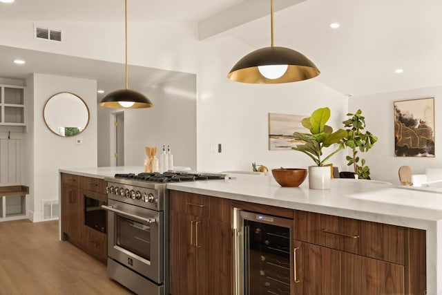 835 Cathy Ln, Cardiff By The Sea, CA 92007 - kitchen with high end stainless steel range, wine cooler, modern cabinets, light wood-style flooring, and light countertops