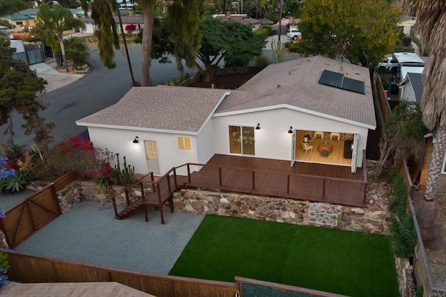 835 Cathy Ln, Cardiff By The Sea, CA 92007 - back of property featuring roof with shingles, solar panels, stucco siding, and stairs