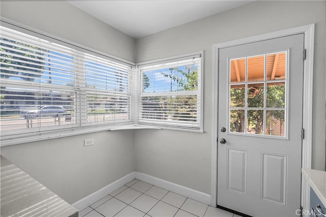 6017 Brockton Ave, Riverside, CA 92506 - entryway with light tile patterned flooring and baseboards