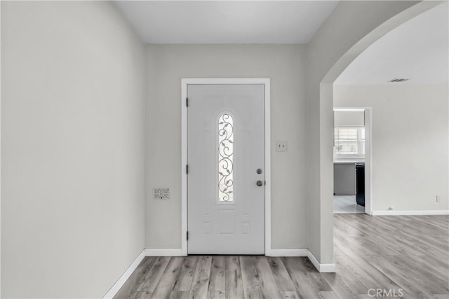 6017 Brockton Ave, Riverside, CA 92506 - entrance foyer with arched walkways and light wood finished floors