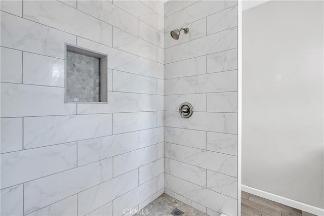 6017 Brockton Ave, Riverside, CA 92506 - bathroom with a tile shower and baseboards