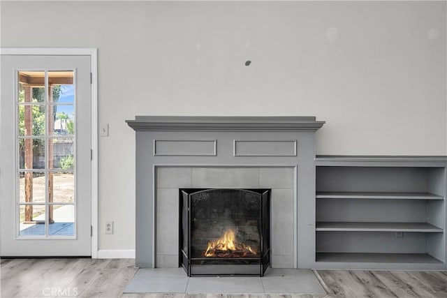 6017 Brockton Ave, Riverside, CA 92506 - detailed view of wood finished floors and a fireplace with flush hearth