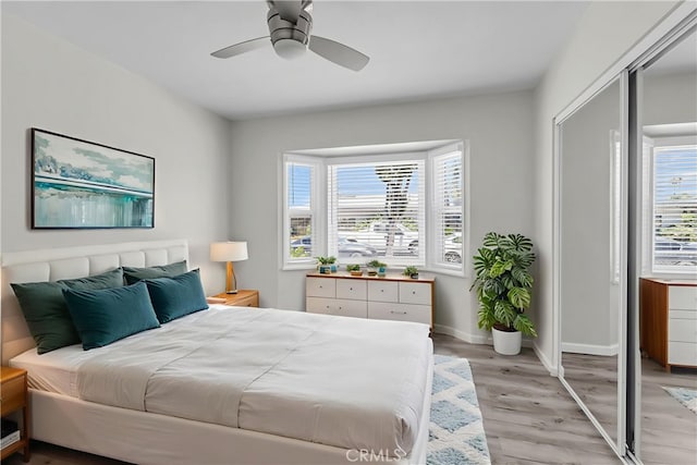 6017 Brockton Ave, Riverside, CA 92506 - bedroom with light wood-style flooring, a closet, and ceiling fan