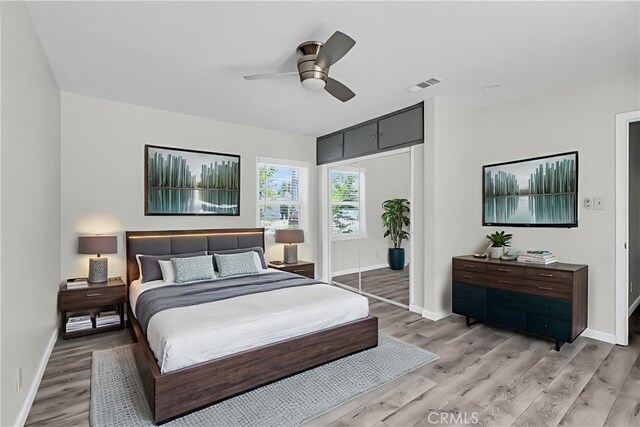 6017 Brockton Ave, Riverside, CA 92506 - bedroom with light wood-type flooring and a ceiling fan