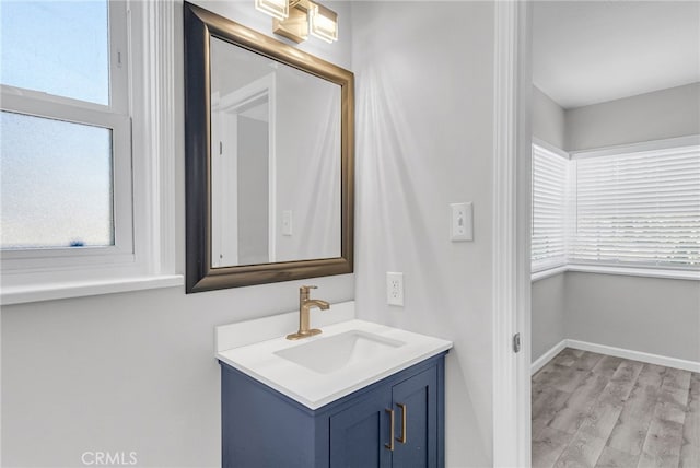 6017 Brockton Ave, Riverside, CA 92506 - bathroom featuring vanity and wood finished floors
