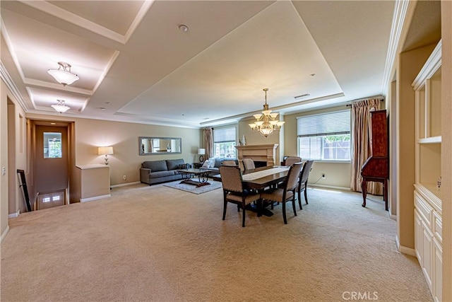 18956 Northern Dancer Ln, Yorba Linda, CA 92886 - dining area featuring a raised ceiling, a chandelier, light carpet, and ornamental molding