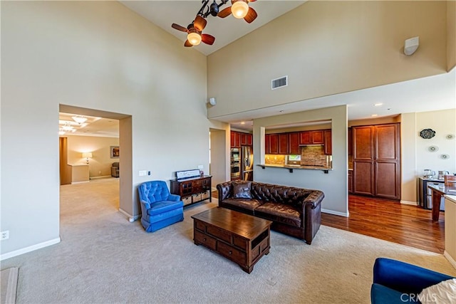 18956 Northern Dancer Ln, Yorba Linda, CA 92886 - carpeted living area featuring a ceiling fan and high vaulted ceiling