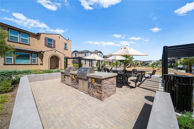 40497 Melrose Dr, Temecula, CA 92591 - view of patio with exterior kitchen and a residential view