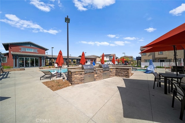 40497 Melrose Dr, Temecula, CA 92591 - view of patio / terrace featuring an outdoor kitchen and a community pool