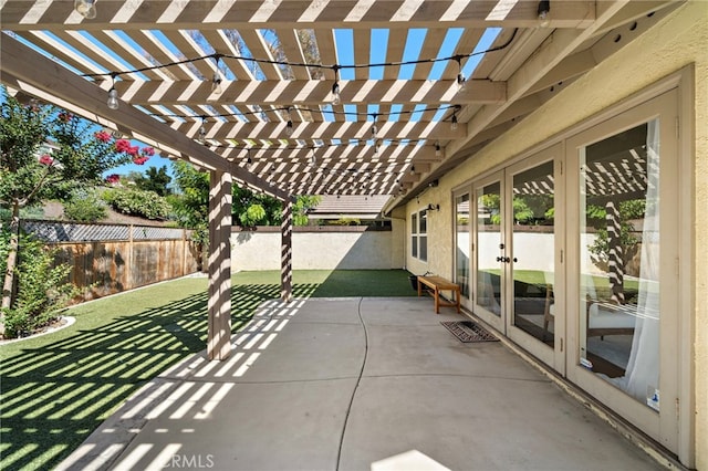 7543 E Twinleaf Trl, Orange, CA 92869 - fenced backyard with french doors, a pergola, and a patio area