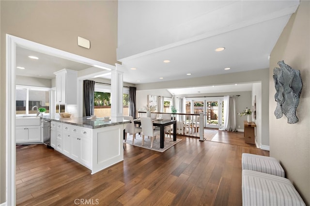 7543 E Twinleaf Trl, Orange, CA 92869 - kitchen with white cabinets, dark wood-type flooring, stainless steel dishwasher, a peninsula, and recessed lighting