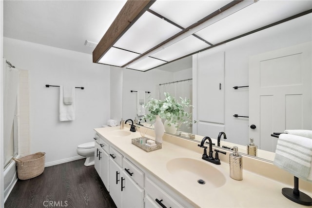 7543 E Twinleaf Trl, Orange, CA 92869 - full bath with double vanity, wood finished floors, and shower / tub combo