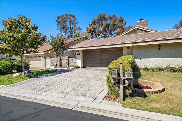 7543 E Twinleaf Trl, Orange, CA 92869 - view of front facade featuring stucco siding, an attached garage, concrete driveway, a chimney, and a front lawn