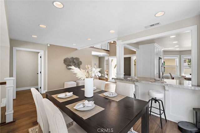 7543 E Twinleaf Trl, Orange, CA 92869 - dining room featuring recessed lighting, dark wood-type flooring, and ornate columns