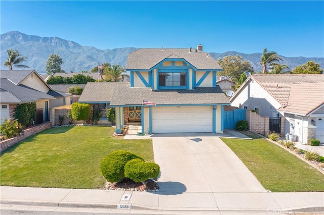 12356 Thistle Dr, Rancho Cucamonga, CA 91739 - view of front of home featuring a mountain view, an attached garage, concrete driveway, and stucco siding