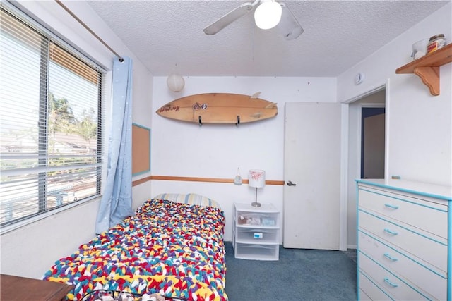 12356 Thistle Dr, Rancho Cucamonga, CA 91739 - carpeted bedroom featuring a textured ceiling and a ceiling fan