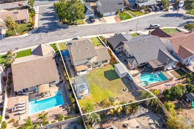 12356 Thistle Dr, Rancho Cucamonga, CA 91739 - aerial perspective of suburban area featuring a pool and property boundaries highlighted