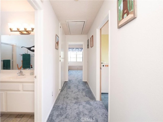 12356 Thistle Dr, Rancho Cucamonga, CA 91739 - hall with attic access and light colored carpet
