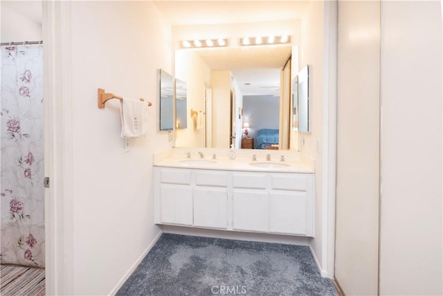 12356 Thistle Dr, Rancho Cucamonga, CA 91739 - full bathroom with double vanity and baseboards