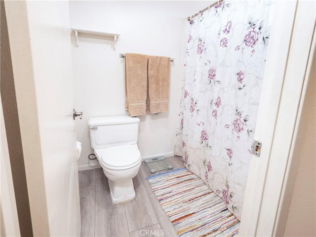 12356 Thistle Dr, Rancho Cucamonga, CA 91739 - bathroom with wood finished floors and a shower with curtain
