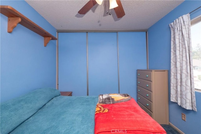 12356 Thistle Dr, Rancho Cucamonga, CA 91739 - bedroom featuring a textured ceiling, carpet flooring, and a ceiling fan