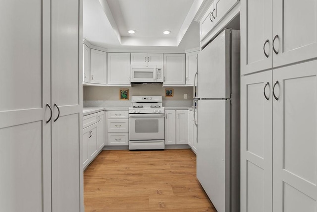 8815 Yuba Cir Unit 1102B, Huntington Beach, CA 92646 - kitchen featuring white appliances, recessed lighting, light countertops, and white cabinets