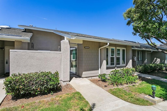 8815 Yuba Cir Unit 1102B, Huntington Beach, CA 92646 - view of front of home with stucco siding