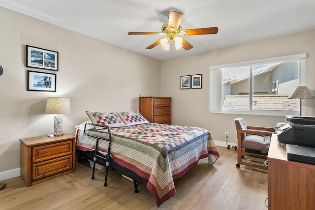 8815 Yuba Cir Unit 1102B, Huntington Beach, CA 92646 - bedroom featuring light wood finished floors and ceiling fan
