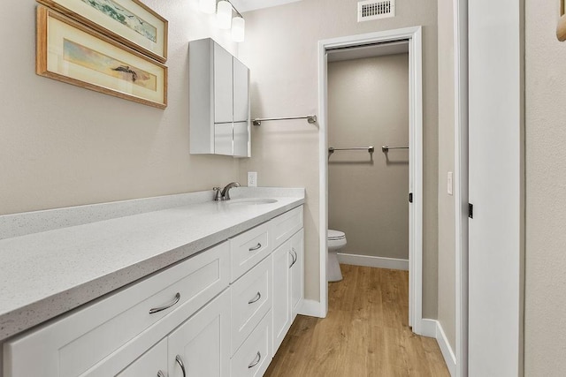 8815 Yuba Cir Unit 1102B, Huntington Beach, CA 92646 - bathroom with wood finished floors and vanity
