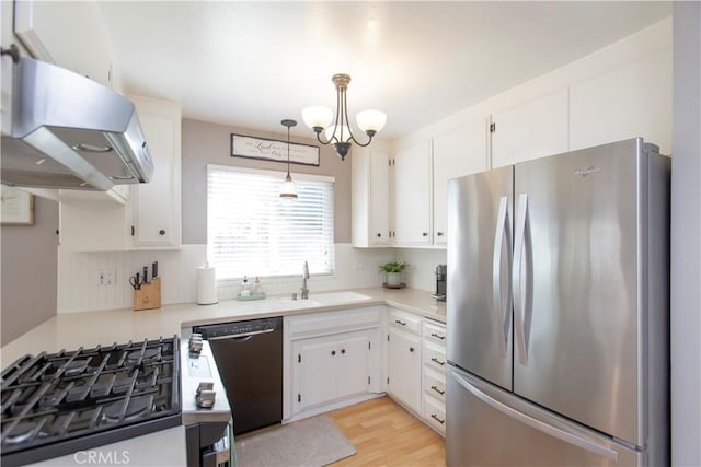 3360 Vanderbilt Ave, Turlock, CA 95382 - kitchen with freestanding refrigerator, dishwasher, ventilation hood, white cabinetry, and light countertops