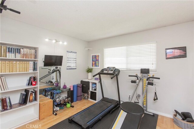 3360 Vanderbilt Ave, Turlock, CA 95382 - workout room with wood finished floors and baseboards