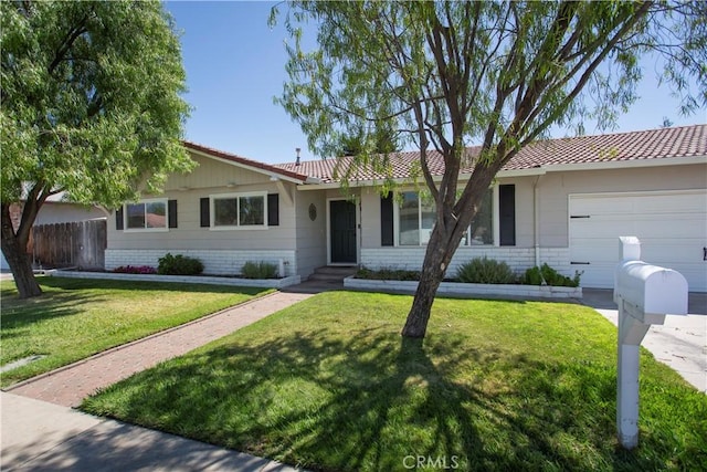 3360 Vanderbilt Ave, Turlock, CA 95382 - ranch-style house featuring an attached garage and brick siding