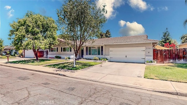 3360 Vanderbilt Ave, Turlock, CA 95382 - single story home with a tile roof, a garage, concrete driveway, and stucco siding