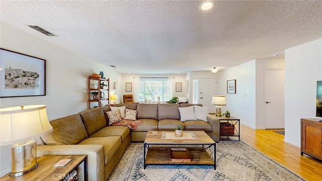 3360 Vanderbilt Ave, Turlock, CA 95382 - living area featuring light wood-type flooring and a textured ceiling