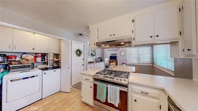 3360 Vanderbilt Ave, Turlock, CA 95382 - kitchen featuring appliances with stainless steel finishes, under cabinet range hood, independent washer and dryer, light wood-style flooring, and light countertops