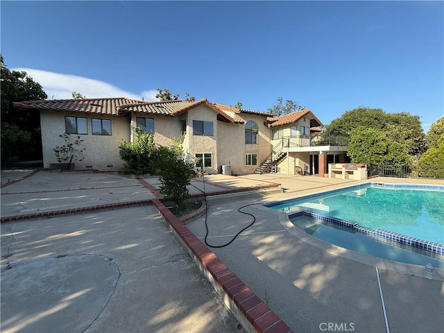 10919 Boulder Canyon Rd, Rancho Cucamonga, CA 91737 - view of pool featuring stairway, a pool with connected hot tub, and a patio