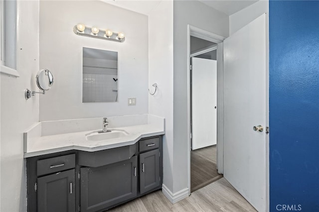 1906 Cloverdale Dr, Pomona, CA 91767 - bathroom featuring wood finished floors and vanity