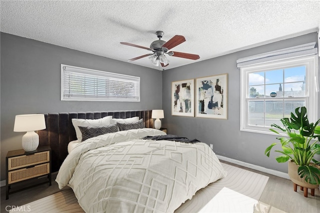 1906 Cloverdale Dr, Pomona, CA 91767 - bedroom with wood finished floors, a textured ceiling, and a ceiling fan