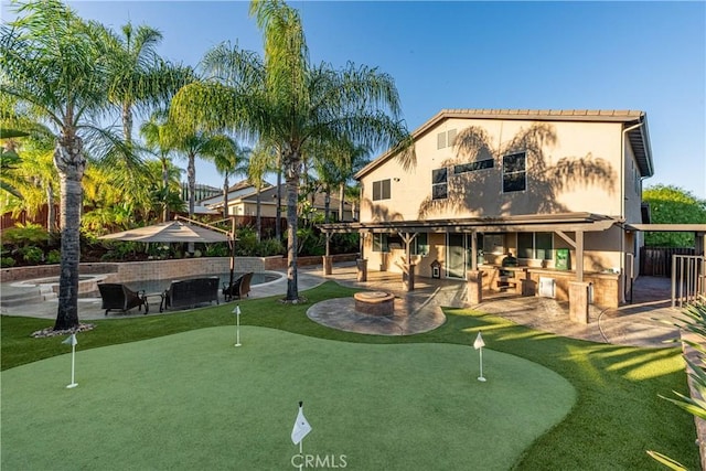 35467 Meadow Park Cir, Wildomar, CA 92595 - rear view of house with a putting green, a patio, and stucco siding