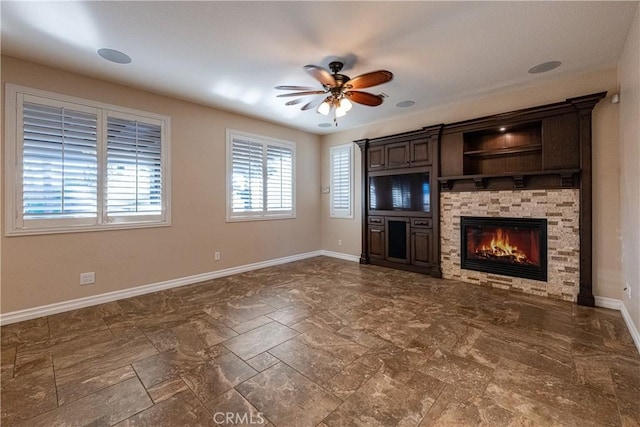 35467 Meadow Park Cir, Wildomar, CA 92595 - unfurnished living room with a ceiling fan, a fireplace, and stone finish flooring