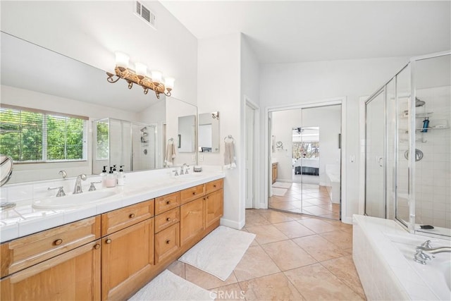22681 Maplewood, Mission Viejo, CA 92692 - full bath featuring double vanity, plenty of natural light, a stall shower, and a garden tub