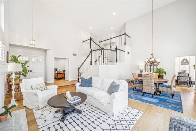 22681 Maplewood, Mission Viejo, CA 92692 - living area featuring a towering ceiling, stairway, light wood-type flooring, a chandelier, and recessed lighting