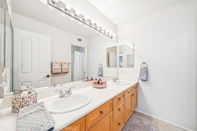 22681 Maplewood, Mission Viejo, CA 92692 - bathroom featuring double vanity and baseboards