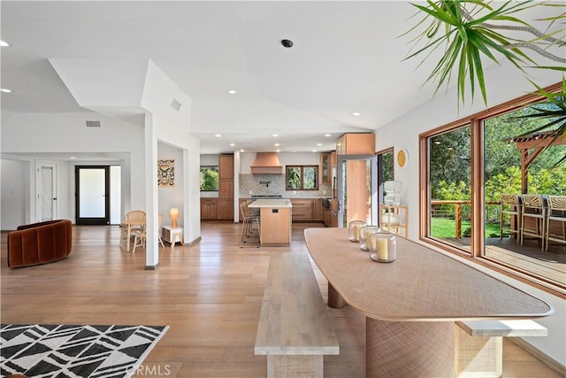 24537 Dry Canyon Cold Creek Rd, Calabasas, CA 91302 - dining room with lofted ceiling, light wood finished floors, and recessed lighting