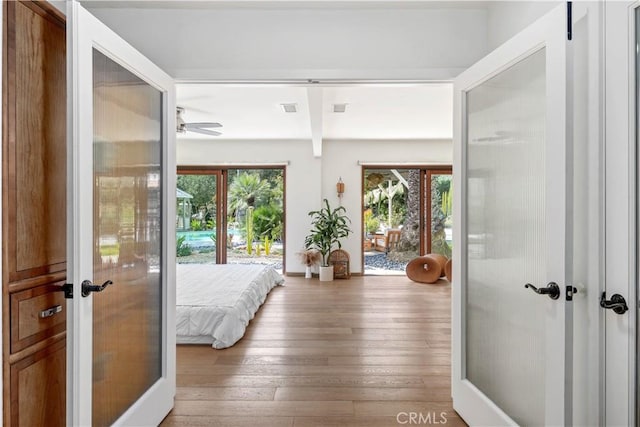24537 Dry Canyon Cold Creek Rd, Calabasas, CA 91302 - bedroom featuring access to exterior, french doors, and hardwood / wood-style floors