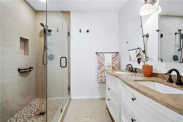 24537 Dry Canyon Cold Creek Rd, Calabasas, CA 91302 - bathroom with a stall shower, double vanity, and tile patterned floors