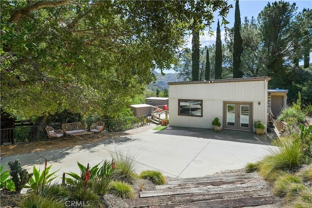 24537 Dry Canyon Cold Creek Rd, Calabasas, CA 91302 - view of patio / terrace with french doors and a mountain view