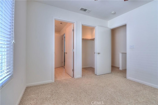 2062 Dunbar Way, Dinuba, CA 93618 - unfurnished bedroom with carpet and a walk in closet