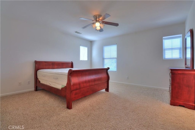 2062 Dunbar Way, Dinuba, CA 93618 - carpeted bedroom featuring multiple windows and a ceiling fan